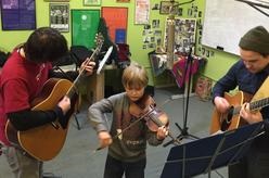 Photo of Children Fiddling